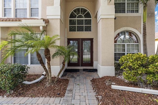 property entrance featuring french doors