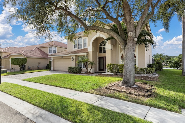 mediterranean / spanish house with a front lawn