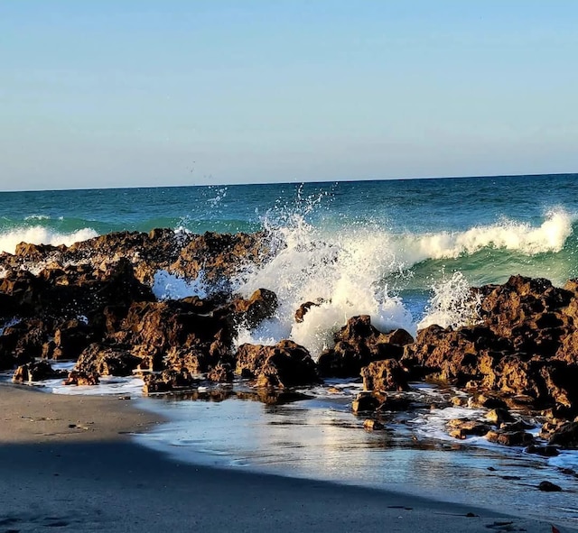 property view of water featuring a view of the beach