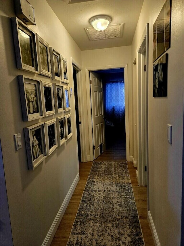 hallway featuring dark hardwood / wood-style flooring