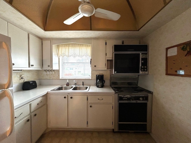 kitchen with a sink, electric stove, light countertops, and a ceiling fan