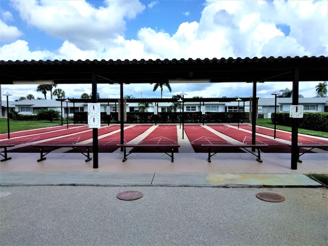 view of home's community featuring shuffleboard