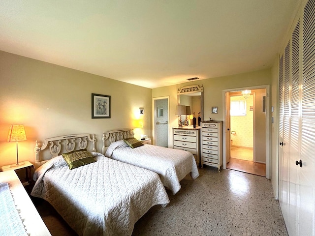 bedroom featuring speckle patterned floor
