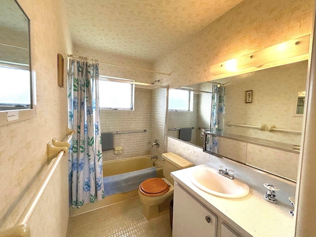 full bath with shower / tub combo with curtain, toilet, and vanity