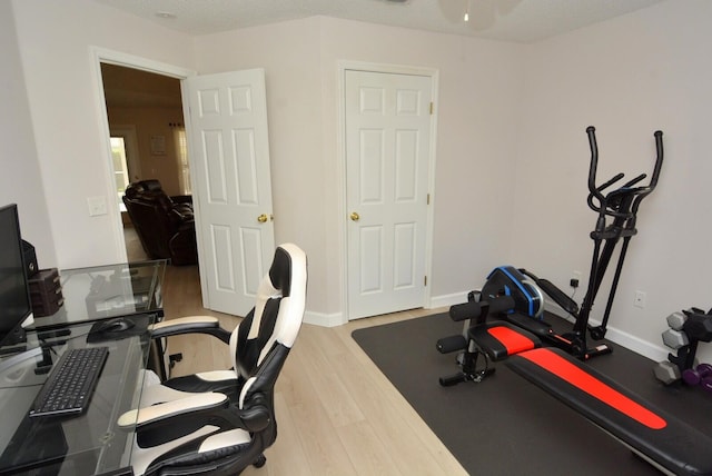 office area with a textured ceiling and hardwood / wood-style flooring