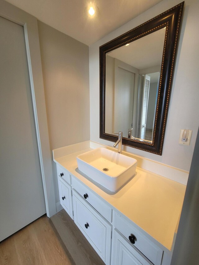 bathroom featuring vanity and hardwood / wood-style flooring