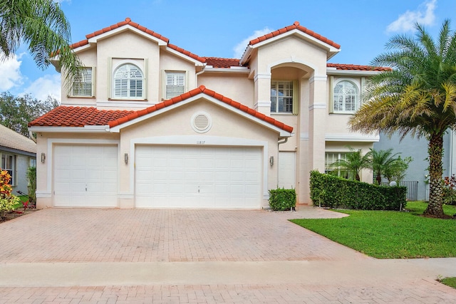 mediterranean / spanish-style house featuring a garage