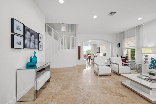 living room featuring decorative columns