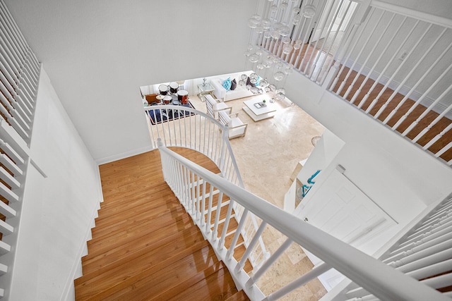 stairs featuring wood-type flooring