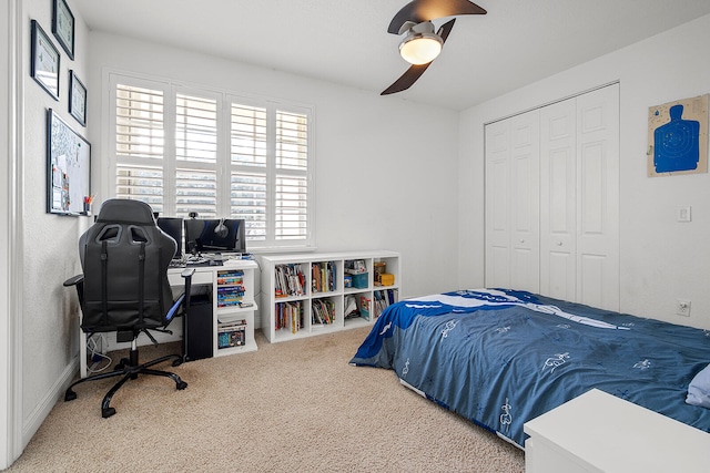 bedroom featuring carpet, ceiling fan, and a closet