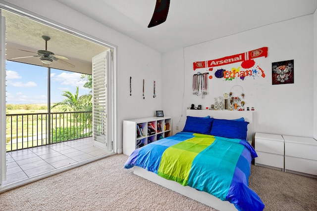 carpeted bedroom with ceiling fan and access to exterior