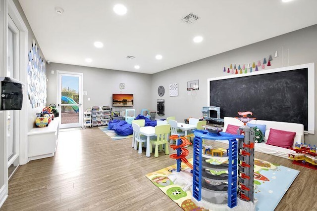 recreation room with hardwood / wood-style flooring