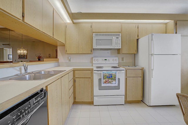 kitchen featuring backsplash, light brown cabinets, an inviting chandelier, sink, and white appliances