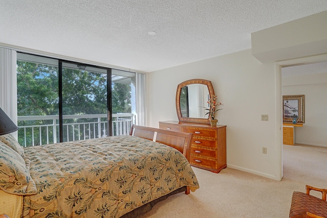 bedroom with access to outside, light carpet, and a textured ceiling