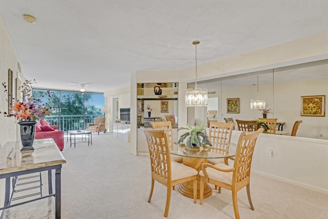 dining room with light colored carpet and ceiling fan