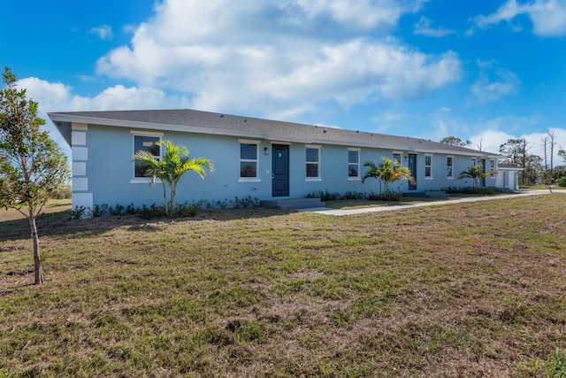 single story home with stucco siding and a front lawn