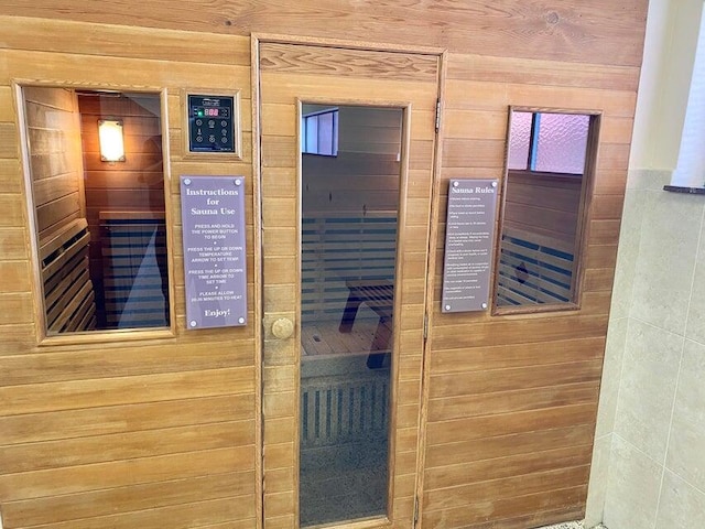 view of sauna / steam room with wooden walls