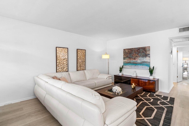 living room with light hardwood / wood-style flooring