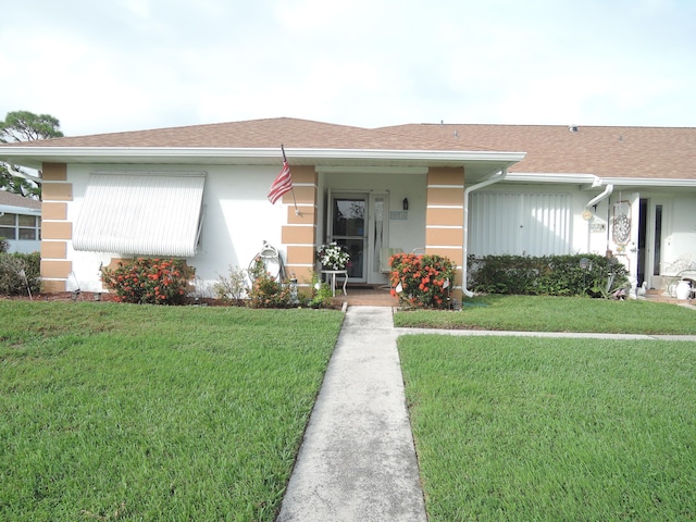 ranch-style home featuring a front yard