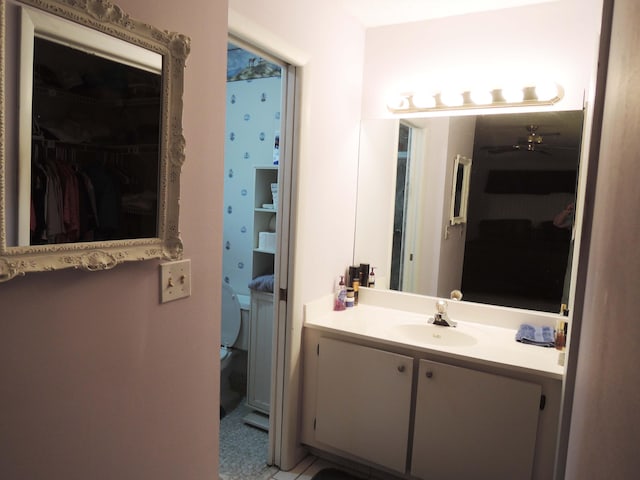 bathroom featuring vanity and toilet