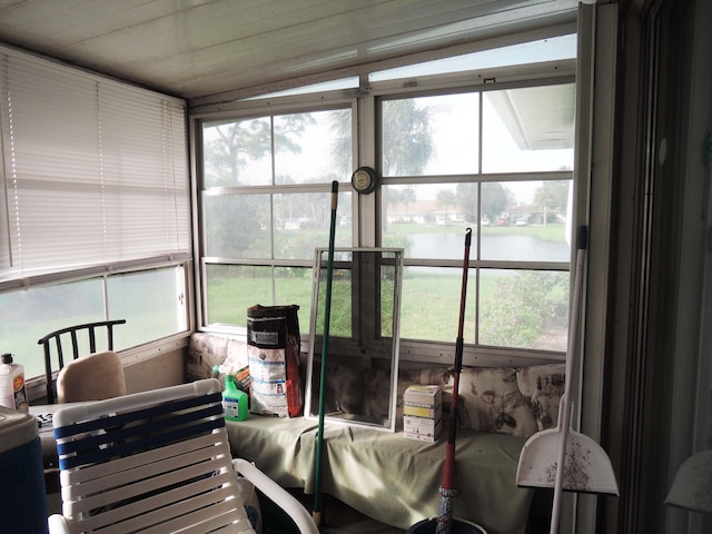 sunroom with a water view and plenty of natural light