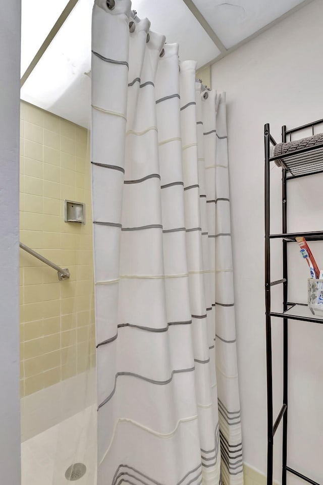 bathroom with a shower with curtain