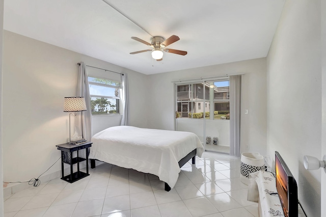 bedroom featuring light tile patterned flooring and ceiling fan