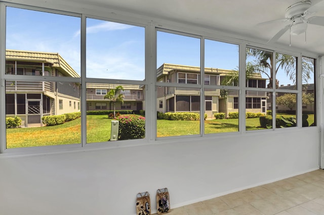 sunroom / solarium with ceiling fan