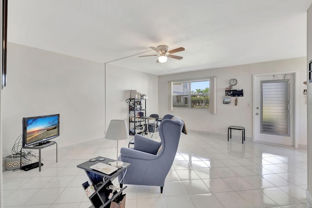 tiled living room with ceiling fan