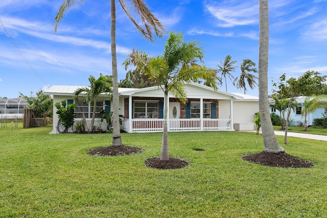 ranch-style house with a front yard and a porch