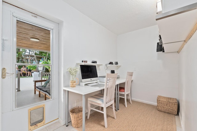 tiled office with a textured ceiling