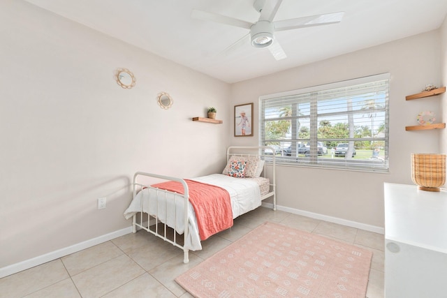 bedroom featuring ceiling fan and tile patterned flooring