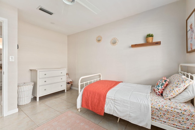 bedroom with ceiling fan and tile patterned floors