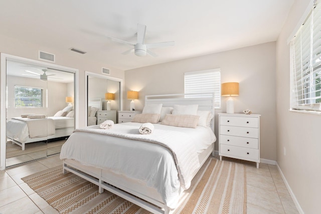 tiled bedroom with ceiling fan