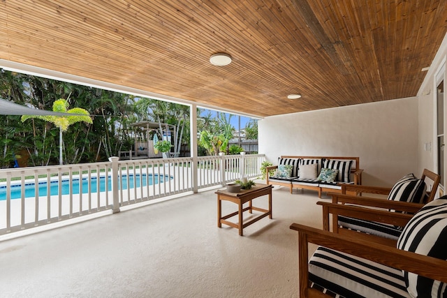 exterior space with an outdoor living space and a fenced in pool