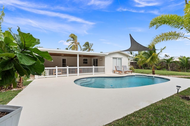 view of swimming pool with a patio