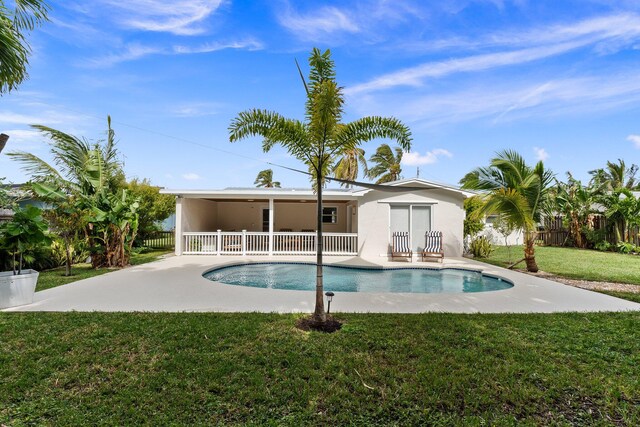 view of pool featuring a patio area and a lawn