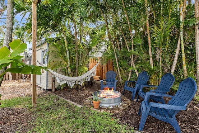 view of yard with an outdoor fire pit