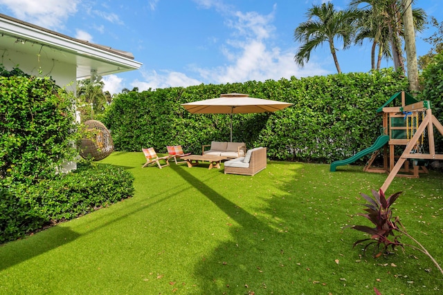 240 El Dorado Ln, Palm Beach, FL 33480 - view of green lawn with outdoor lounge area and a playground