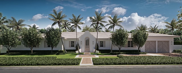 240 El Dorado Ln, Palm Beach, FL 33480 - view of front facade with a garage, stucco siding, a front lawn, and driveway