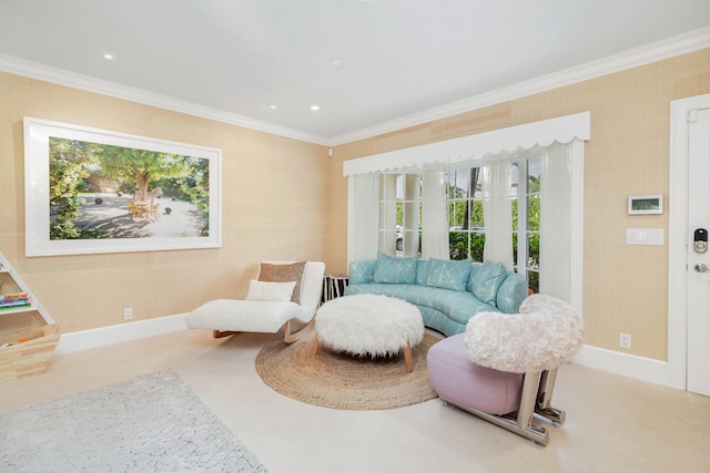 sitting room with a healthy amount of sunlight and ornamental molding