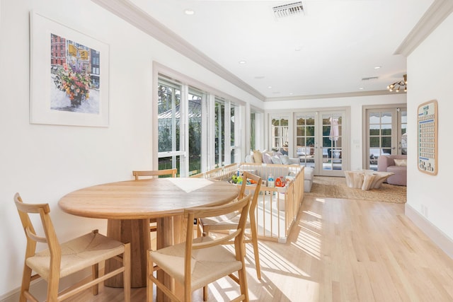 240 El Dorado Ln, Palm Beach, FL 33480 - dining space featuring french doors, light wood-style floors, crown molding, recessed lighting, and baseboards