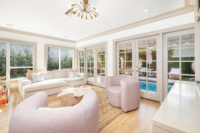 240 El Dorado Ln, Palm Beach, FL 33480 - sunroom featuring french doors and a chandelier