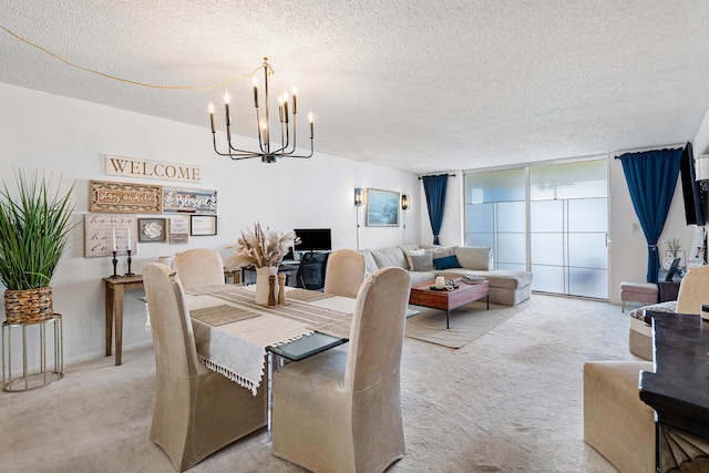 carpeted dining room featuring a textured ceiling and a chandelier