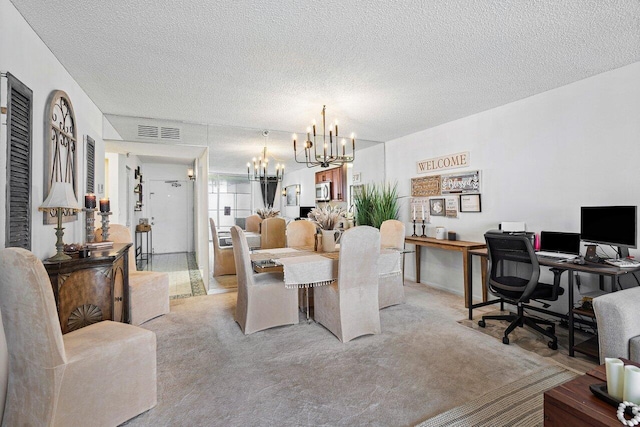 office space featuring a notable chandelier, light colored carpet, and a textured ceiling