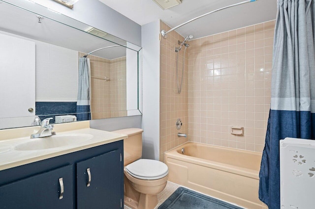 full bathroom featuring shower / tub combo, vanity, and toilet