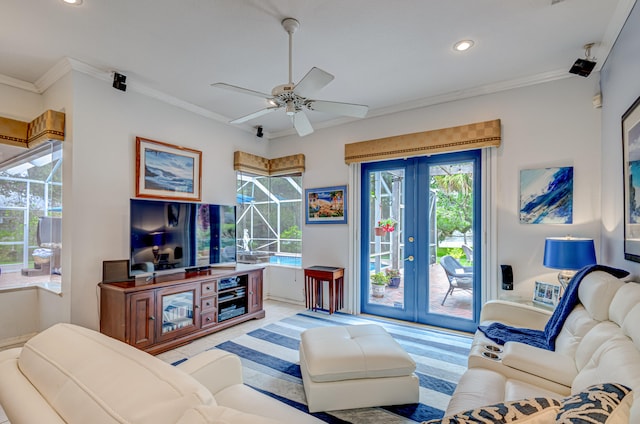 living room with ceiling fan and ornamental molding