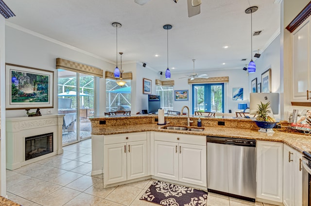 kitchen featuring a wealth of natural light, sink, crown molding, and stainless steel appliances