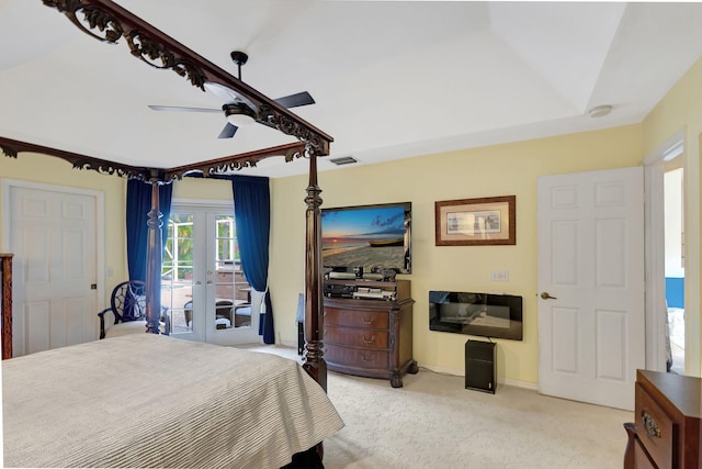 bedroom featuring access to outside, french doors, light carpet, and ceiling fan