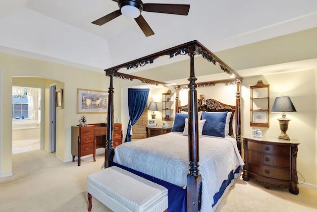 carpeted bedroom with ceiling fan and connected bathroom